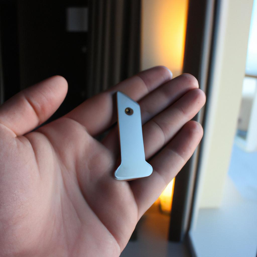 Person holding hotel room key